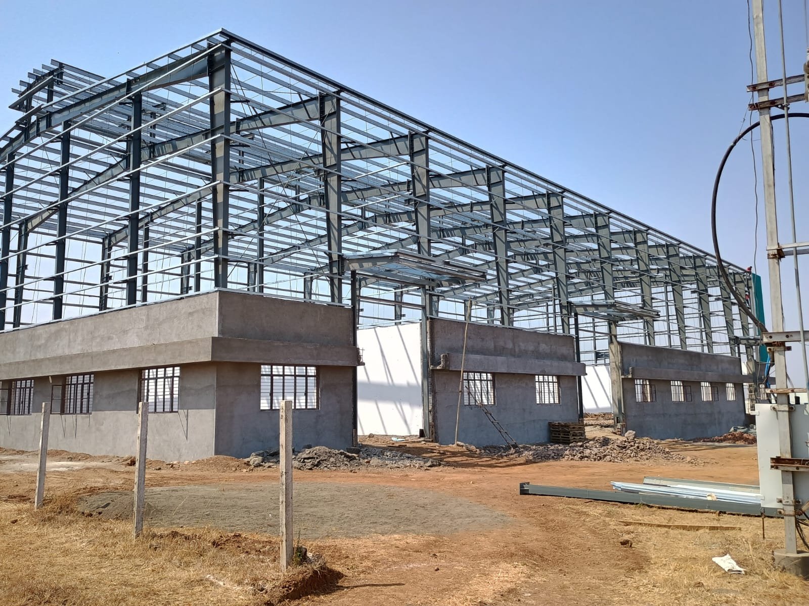 Multi-level industrial framing with masonry integration